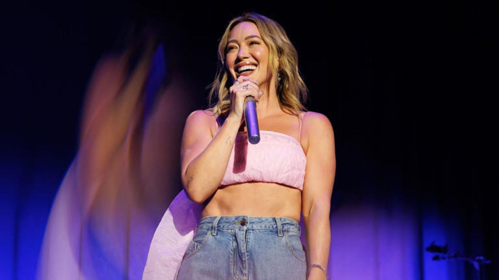Hilary Duff performs with Joel Madden and Good Charlotte during a surprise duet at Madison Square Garden in New York City.